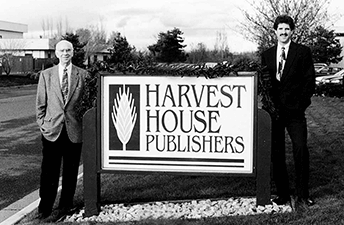 Bob Hawkins, Sr. and Bob Hawkins, Jr. with sign